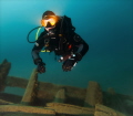 Diver on the wreck of The King at 30m (100ft) depth in Tobermory, Canada 