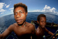 Local kids visit the dive deck. Kavieng PNG 