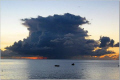 Cumulonimbus.
Sunset.
Fishing boats in the distance. 