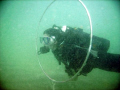 Student swimming through the hoops during a performance buoyancy class at Lauderdale by the Sea 