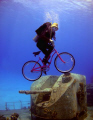 The "E.T." shot - riding a bike over the guns of the M/V Tibbetts - harder than it looks - buoyancy was an issue! 