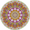 Kaleidoscopic image made from brightly colored coral.  Lots of detail in the coral makes for an intricate pattern. 