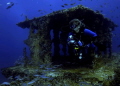 Becky exploring the Wit Shoal Wreck Tower at St.Thomas 