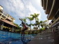 First step to diving/ my daughter just learn to swim ,and I'm teaching her jumps and dives into swimming pool  . Picture was taken in right Timing  ! So It looks like she actually stand on the water :)