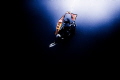 Diver preparing an inflatable beacon during stormy (low visibility) weather to be located by surrounding boats