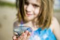 Child Holding Man-Of-War Kite
