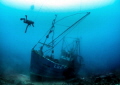 Silent Memory
Diver exploring the wreck of a small fishing boat which sank off Shetland. Shot with Canon 7D - Tokina 10-17 - Ikelite housing. Natural light at 22m.