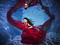 Taken in a small pool in Austria, with help from Julia Margarita Hödl, model and creative director on this project. She made the dress herself out of fabric we bought at flee markets! 
Canon S100 lit with two S2000 strobes and sone sunshine!