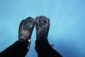 A picture of my fins the first time I put them in the Great Barrier Reef. I'd been planning the dive for years and was excited to finally be there. The water was bluer and clearer than I expected. Shot with my Canon 60D in an Ikelite housing.