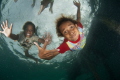 Local children of the Arborek Jetty