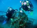 Divers on wheel of the wreck of the Teti, taken with Canon Powershot Pro 1 with Ikelite strobe at 35m