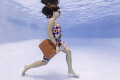 Walking to Work. This was taken at the end of the shoot when this first time underwater model really got into her stride! It was shot in a swimming pool using the Canon 5D Mark III and Ikelite housing.