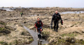 Coming ashore after completing a dive in Sagami Bay at Hayama, Japan.  A certain 