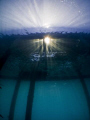 sunburst under the jetty in the morning. Olympus SP-350, Inon fisheye lens. 
