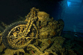 Motorcycle in Hold of the SS Thistlegorm.  Canon 10-22mm wide angle.  Balanced natural light through hold doors with strobes with a 1/50 shutter.