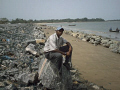 I am at the sea bank of the costal rock looking my country beautiful sea.