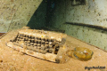 This typewriter and ash cup is placed onto the table of the captain's cabin of a wreck. This ship is really fantastic to be visited
