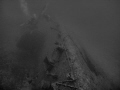 A wide angle shot of the USS Emmons, showing the final blow from a Japanese Zero.