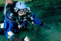 Making the jump. Cave diver running a jump reel.