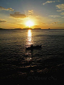 Lone Fisherman slowly chugging home in his sampan.
Canon G10