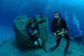 My dive buddy, Andy, chilling in the background on the Capt. Keith Tibbets wreck on Cayman Brac.  

Using a Canon 5D Mark II Fisheye lens