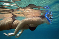 Young woman skindiving in the Sea of Crete.
