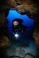 The undrwater model Belen Caro entering a cave in Tenerife