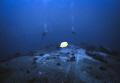 Larry and Alisa on up side down LCU off Hawaii Kai, Oahu, Hawaii. Nikonos V camera and 15 mm lens used.